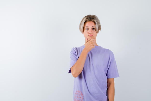 Expressive young boy posing in the studio