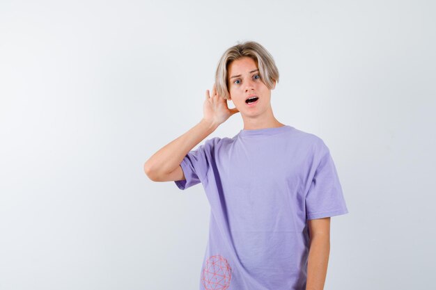 Expressive young boy posing in the studio