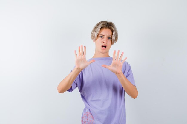 Expressive young boy posing in the studio