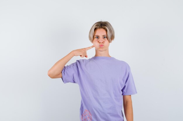 Expressive young boy posing in the studio