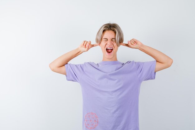 Expressive young boy posing in the studio