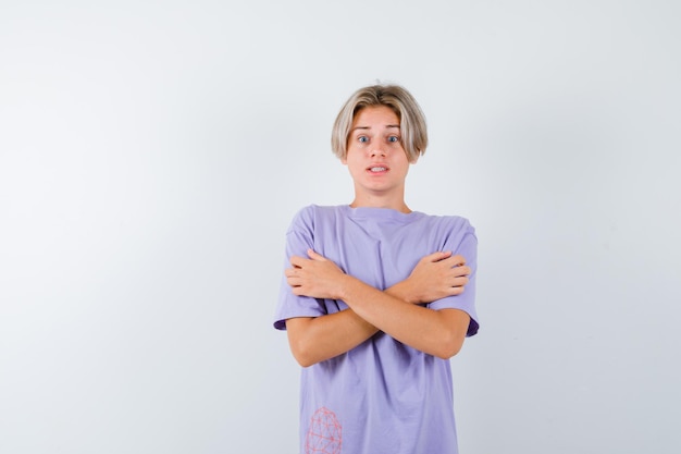 Expressive young boy posing in the studio