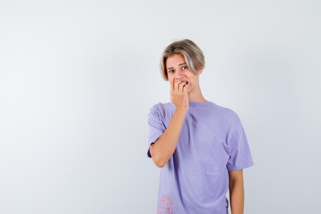 Expressive young boy posing in the studio