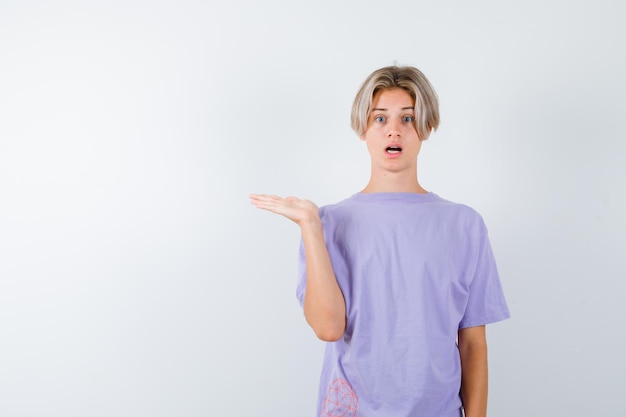 Expressive young boy posing in the studio