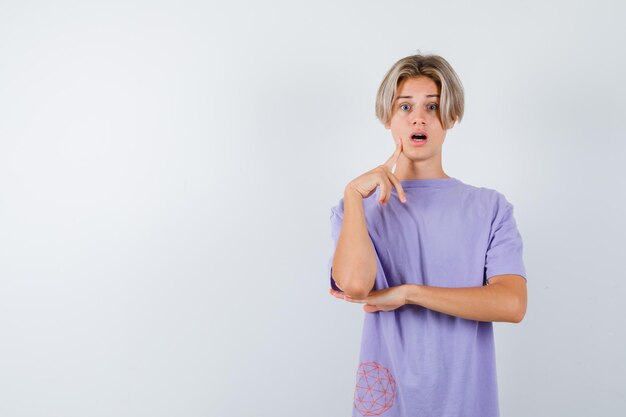 Expressive young boy posing in the studio