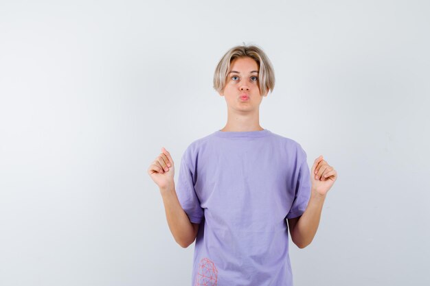 Expressive young boy posing in the studio