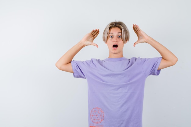 Expressive young boy posing in the studio