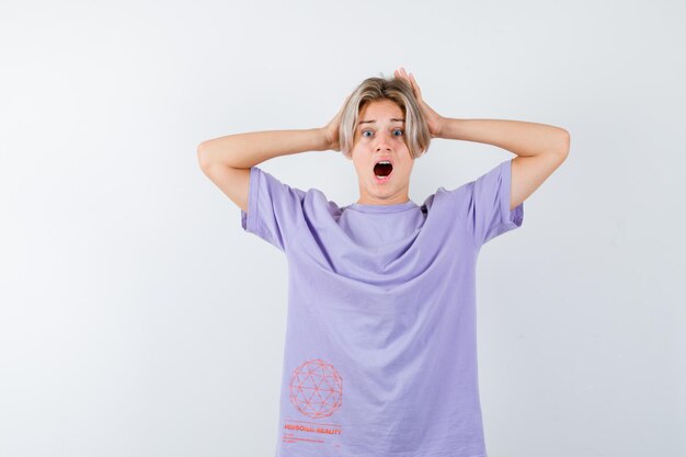 Expressive young boy posing in the studio