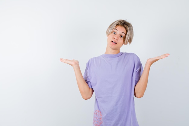 Expressive young boy posing in the studio