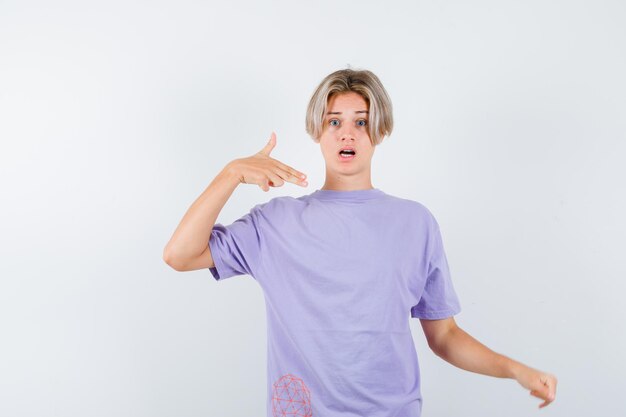 Expressive young boy posing in the studio