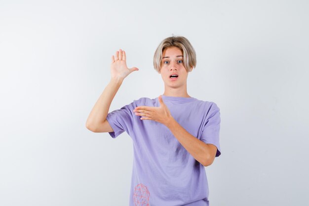 Expressive young boy posing in the studio