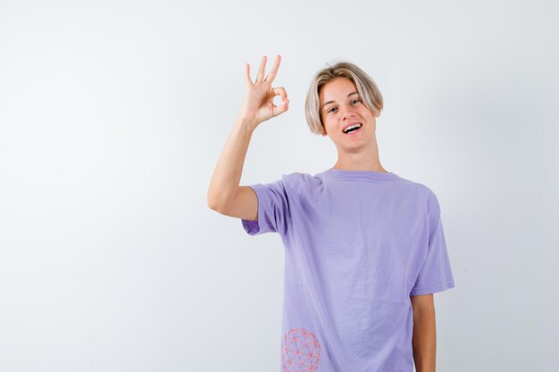 Expressive young boy posing in the studio