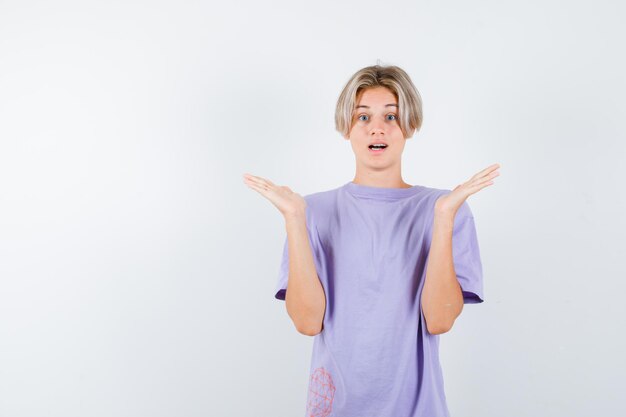 Expressive young boy posing in the studio