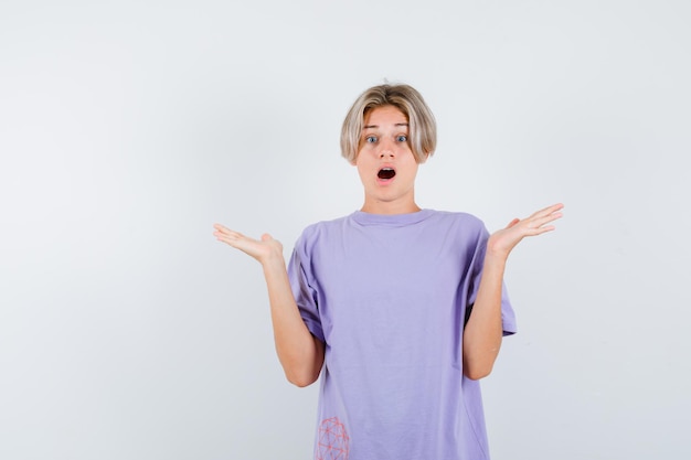 Expressive young boy posing in the studio