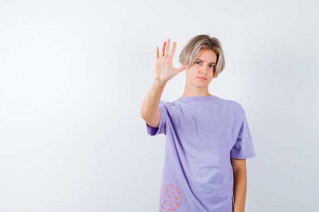 Expressive young boy posing in the studio