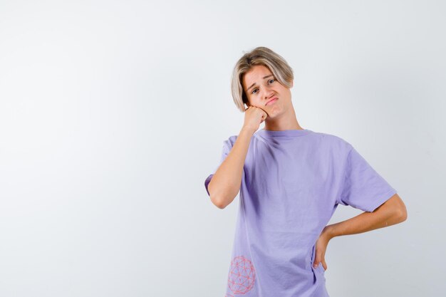 Expressive young boy posing in the studio