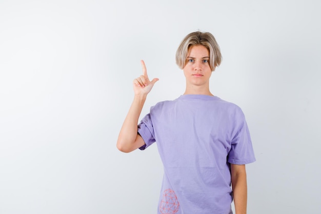 Expressive young boy posing in the studio