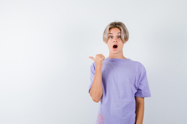 Expressive young boy posing in the studio