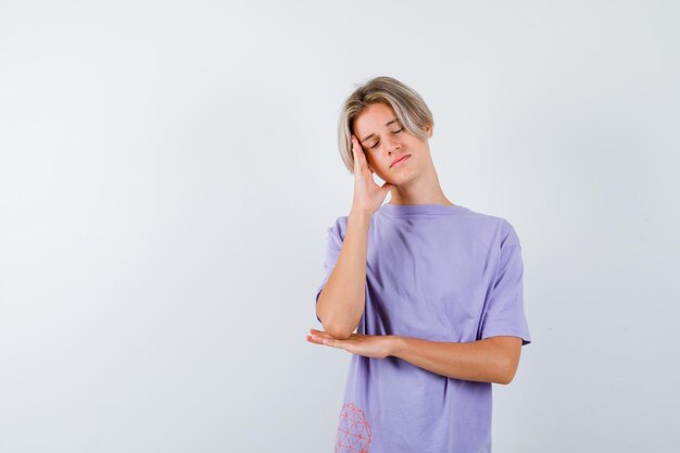 Expressive young boy posing in the studio