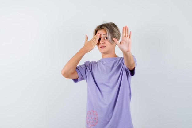 Expressive young boy posing in the studio