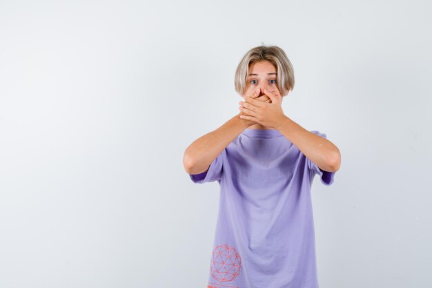 Expressive young boy posing in the studio