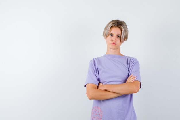 Expressive young boy posing in the studio