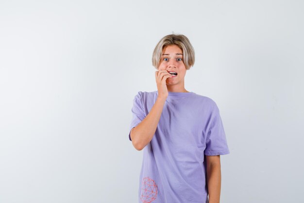 Expressive young boy posing in the studio