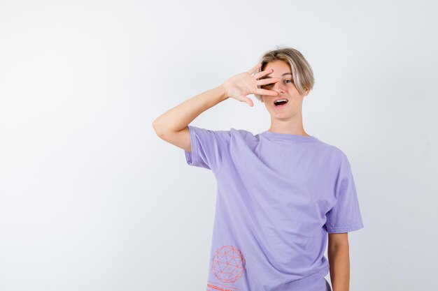 Expressive young boy posing in the studio