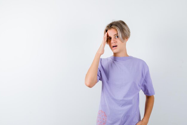 Expressive young boy posing in the studio