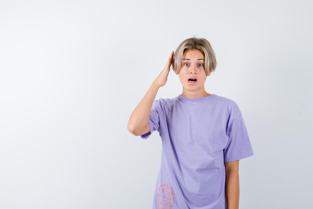 Expressive young boy posing in the studio