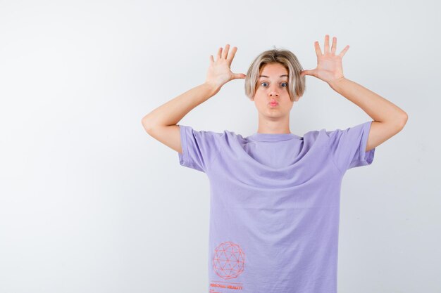 Expressive young boy posing in the studio