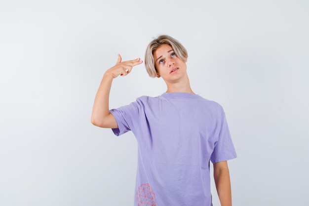 Expressive young boy posing in the studio