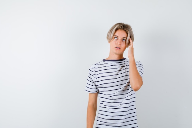 Expressive young boy posing in the studio