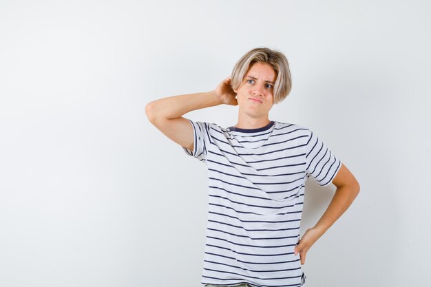 Expressive young boy posing in the studio