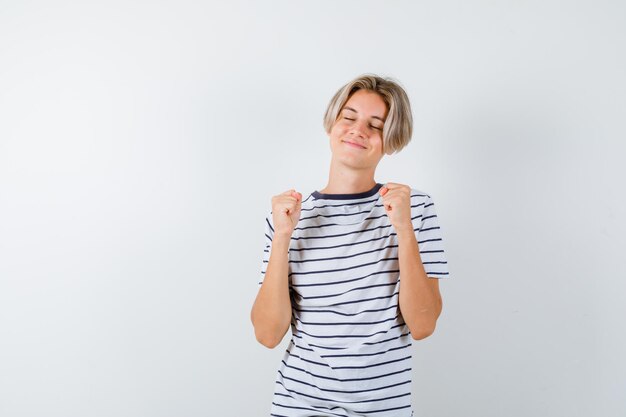 Expressive young boy posing in the studio