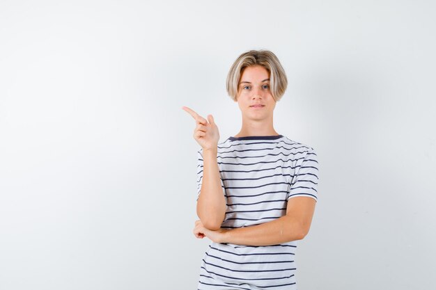 Expressive young boy posing in the studio