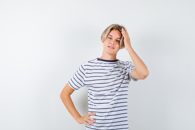 Expressive young boy posing in the studio