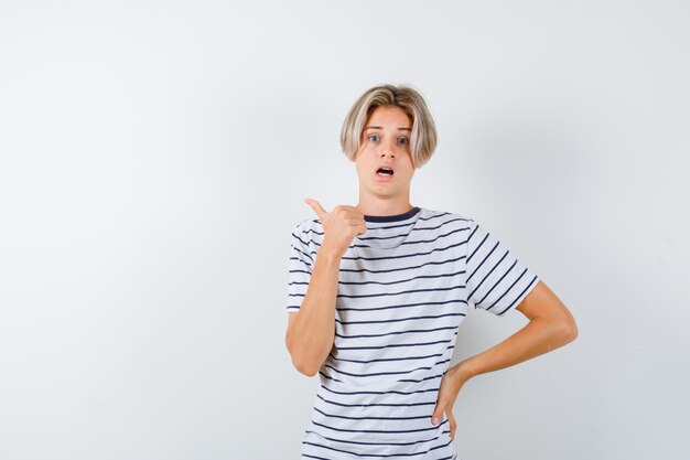 Expressive young boy posing in the studio