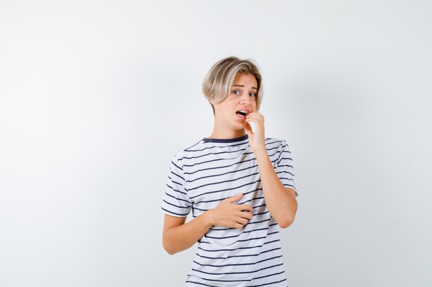 Expressive young boy posing in the studio