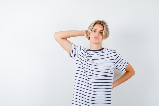 Expressive young boy posing in the studio