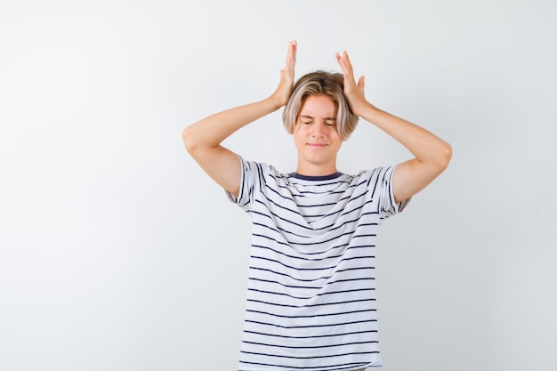 Expressive young boy posing in the studio