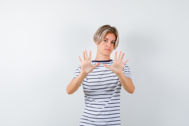 Expressive young boy posing in the studio