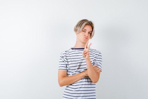 Expressive young boy posing in the studio