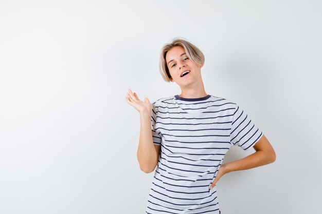 Expressive young boy posing in the studio