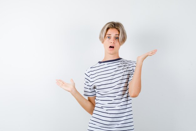 Expressive young boy posing in the studio