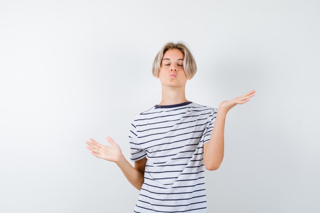 Expressive young boy posing in the studio