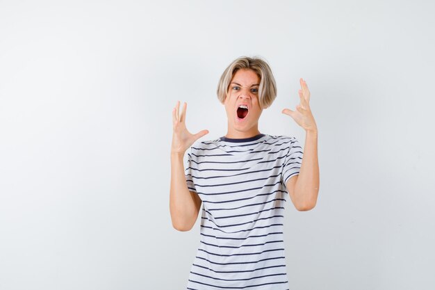 Expressive young boy posing in the studio