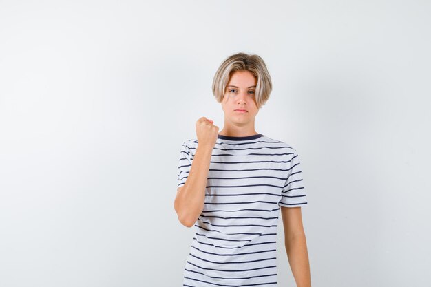 Expressive young boy posing in the studio