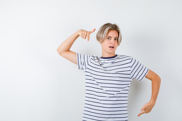 Expressive young boy posing in the studio