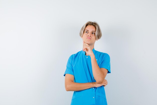 Expressive young boy posing in the studio